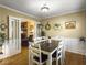 Bright dining room with hardwood floors and a farmhouse table at 1001 Shinnecock Hills Ct, Summerville, SC 29483