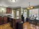 Eat-in kitchen with granite island, stainless steel appliances, and hardwood floors at 1001 Shinnecock Hills Ct, Summerville, SC 29483