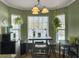 Bright kitchen nook with a wood table and chairs, and large windows at 1001 Shinnecock Hills Ct, Summerville, SC 29483