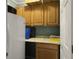 Small galley kitchen with wood cabinets and granite countertop at 1001 Shinnecock Hills Ct, Summerville, SC 29483