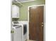 Laundry room with washer, dryer, and built-in cabinets at 1001 Shinnecock Hills Ct, Summerville, SC 29483
