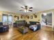 Spacious living room with hardwood floors, a fireplace, and comfortable seating at 1001 Shinnecock Hills Ct, Summerville, SC 29483
