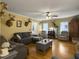Living room with hardwood floors, comfortable seating, and mounted deer heads at 1001 Shinnecock Hills Ct, Summerville, SC 29483