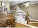 Wooden staircase with white railing and maroon steps at 1001 Shinnecock Hills Ct, Summerville, SC 29483