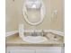 Clean bathroom with a round mirror, wallpaper accent, and white sink at 101 Winston Cir, Summerville, SC 29485