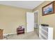 Bedroom with door to another room, neutral walls, a small table, and a white shelf at 101 Winston Cir, Summerville, SC 29485