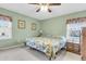 Bright bedroom featuring natural light, a ceiling fan, and a comfortable queen bed at 101 Winston Cir, Summerville, SC 29485