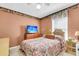 Traditional bedroom featuring floral bedding, wood furniture, and a cozy, warm atmosphere at 101 Winston Cir, Summerville, SC 29485