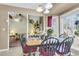 Bright dining area features a light fixture, large windows, and flows into a comfortable living space at 101 Winston Cir, Summerville, SC 29485