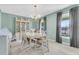 Traditional dining room boasting a chandelier, a china cabinet, and light-filled windows at 101 Winston Cir, Summerville, SC 29485