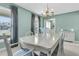 Open dining room with a light blue color scheme and a large marble table at 101 Winston Cir, Summerville, SC 29485
