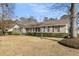 Lovely single-story home featuring brick and siding, complemented by mature trees and manicured shrubs at 101 Winston Cir, Summerville, SC 29485