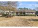 Charming single-story brick home featuring a covered front porch and well-maintained landscaping at 101 Winston Cir, Summerville, SC 29485