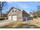 Brick garage with a fenced yard in the background, showcasing the building's exterior at 101 Winston Cir, Summerville, SC 29485