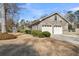 Brick home exterior featuring a two-car garage and well-maintained landscaping at 101 Winston Cir, Summerville, SC 29485