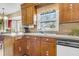 Bright kitchen featuring a large window over the sink, wood cabinets, and functional design at 101 Winston Cir, Summerville, SC 29485