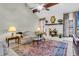 Cozy living room with a vaulted ceiling, fireplace, and patterned area rug at 101 Winston Cir, Summerville, SC 29485