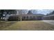 Charming brick home with a well-maintained front yard and attached garage at 102 Barrington Blvd, Goose Creek, SC 29445