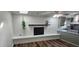 Inviting living room featuring a fireplace, hardwood floors, and modern kitchen at 102 Barrington Blvd, Goose Creek, SC 29445