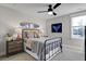 Bedroom with a metal bed, bedside tables with lamps, and a surfboard wall decoration at 108 Crosscut Ln, Summerville, SC 29486