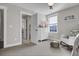 Bright bedroom with a white dresser, neutral walls, and a large window at 108 Crosscut Ln, Summerville, SC 29486