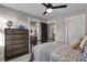 Bedroom with a dark wood dresser and adjacent bathroom entrance at 108 Crosscut Ln, Summerville, SC 29486