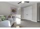 Bright Bedroom with white crib, modern ceiling fan, neutral walls, and a turtle art piece at 108 Crosscut Ln, Summerville, SC 29486