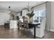 Open dining area featuring wood floors, an elegant chandelier and natural light from a large window at 108 Crosscut Ln, Summerville, SC 29486