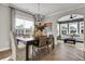 Open dining area with modern decor, lots of natural light, and views into living space at 108 Crosscut Ln, Summerville, SC 29486