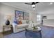 Bright sitting room with beach-themed artwork, creating a serene and inviting atmosphere at 108 Crosscut Ln, Summerville, SC 29486