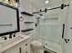 Bathroom features include floating shelves, white tile, marble floors and glass shower door at 133 Larson Dr, Summerville, SC 29485