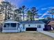 Charming single-story home featuring a screened-in porch and inviting curb appeal at 133 Larson Dr, Summerville, SC 29485