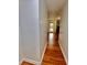 Hallway that features hardwood floors leading to a Gathering room with a fireplace and a large window at 133 Larson Dr, Summerville, SC 29485