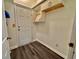 Mud room features hardwood floors, white cabinets, and entry to the outside at 133 Larson Dr, Summerville, SC 29485