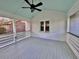 The large screened-in porch has a ceiling fan and freshly painted deck at 133 Larson Dr, Summerville, SC 29485