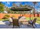 Relaxing backyard patio with seating area and umbrella at 1385 Fairfield Ave, Charleston, SC 29407