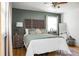 Spacious bedroom with hardwood floors and an accent wall at 1385 Fairfield Ave, Charleston, SC 29407