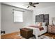 Bright bedroom with wood floors, featuring a comfortable bed and stylish decor at 1385 Fairfield Ave, Charleston, SC 29407