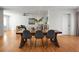 Open concept dining area with hardwood floors and a rustic wooden dining table at 1385 Fairfield Ave, Charleston, SC 29407
