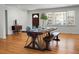 Spacious dining area featuring a long wooden table with blue chairs and a bench at 1385 Fairfield Ave, Charleston, SC 29407