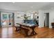 Open concept dining room with a farmhouse table and view into the kitchen at 1385 Fairfield Ave, Charleston, SC 29407