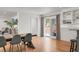 Bright dining room features hardwood floors and a table with seating for six at 1385 Fairfield Ave, Charleston, SC 29407