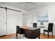 Home office with wood floors, featuring a vintage desk and two chairs at 1385 Fairfield Ave, Charleston, SC 29407