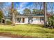 Charming ranch home with white brick exterior and gray shutters at 1385 Fairfield Ave, Charleston, SC 29407