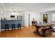 Renovated kitchen boasts granite counters, stainless steel appliances, and blue cabinets at 1385 Fairfield Ave, Charleston, SC 29407