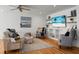 Cozy living room featuring a comfortable sofa and armchairs, hardwood floors, and built-in shelving at 1385 Fairfield Ave, Charleston, SC 29407