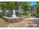 Charming courtyard fountain with brick pathway and relaxing seating area at 1632 Telfair Way, Charleston, SC 29412