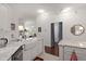 Bright kitchen features white cabinetry, granite counters, and a farmhouse sink at 1632 Telfair Way, Charleston, SC 29412