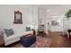 Living room with hardwood floors, white couch, and rocking chair at 1632 Telfair Way, Charleston, SC 29412