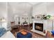 Living room with fireplace, hardwood floors, and comfortable seating at 1632 Telfair Way, Charleston, SC 29412